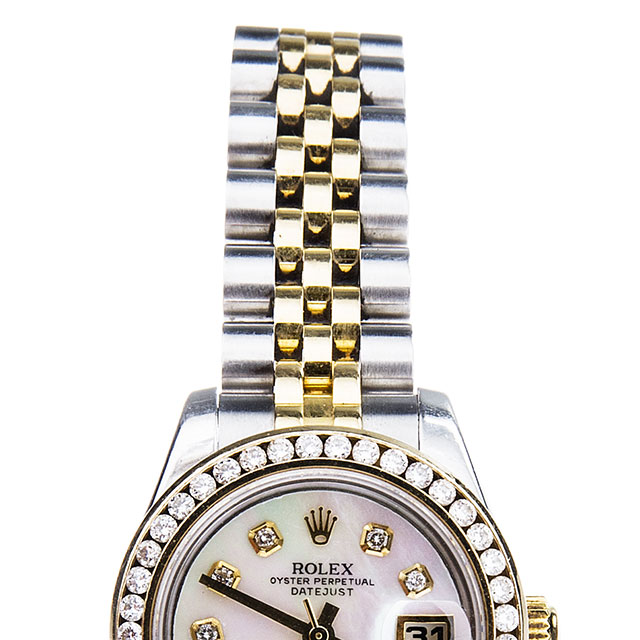 Before restoration of Rolex Datejust in stainless steel and yellow gold with a white dial and diamond bezel.