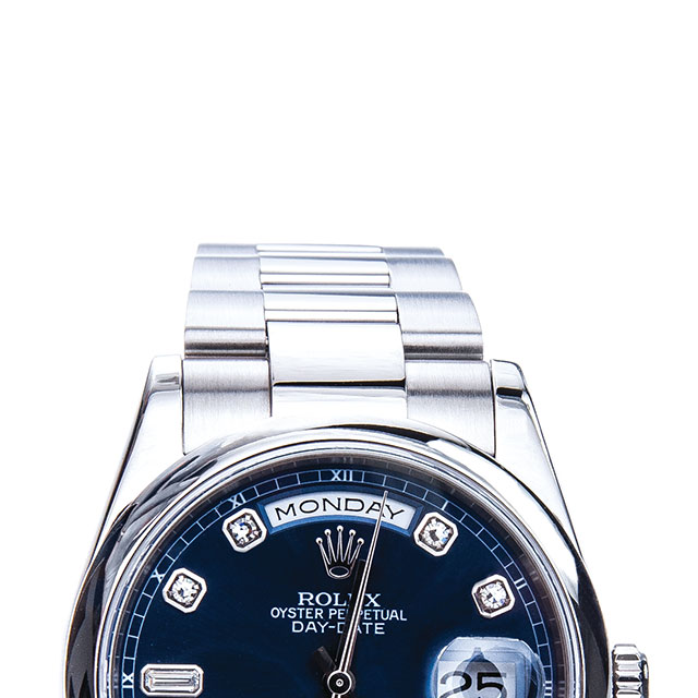 After restoration of Rolex Day-Date in stainless steel with a blue dial.