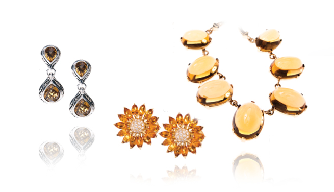 Two pairs of earrings and one statement necklace all set with citrines.