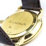 Close-up of case back of pre-owned men’s Blancpain in yellow gold.