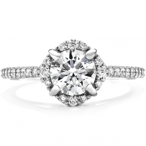 White gold diamond engagement ring with diamond halo and diamonds in the band.