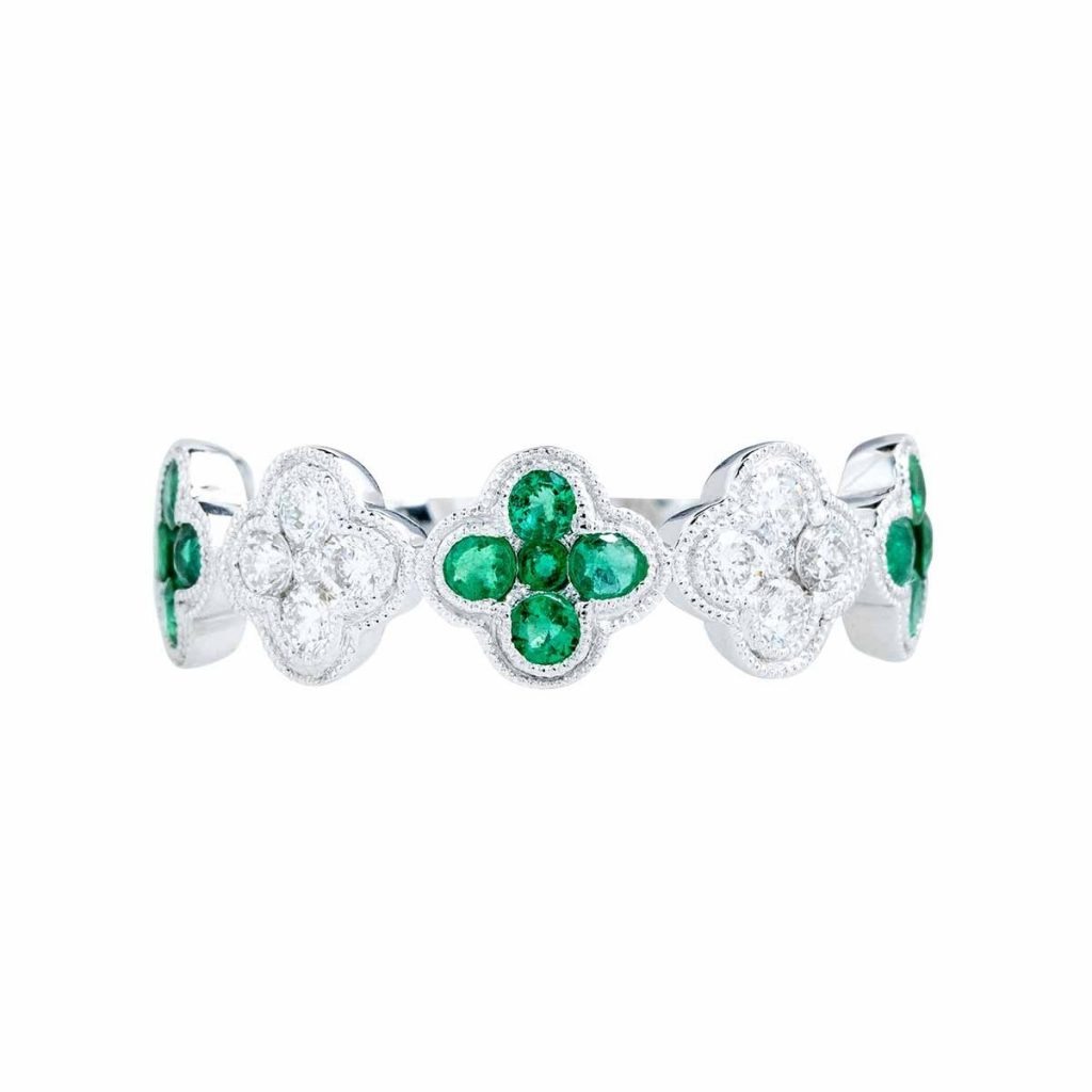 White gold clover eternity wedding band set with emeralds and diamonds.