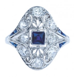 Edwardian platinum statement ring set with blue sapphires and diamonds.