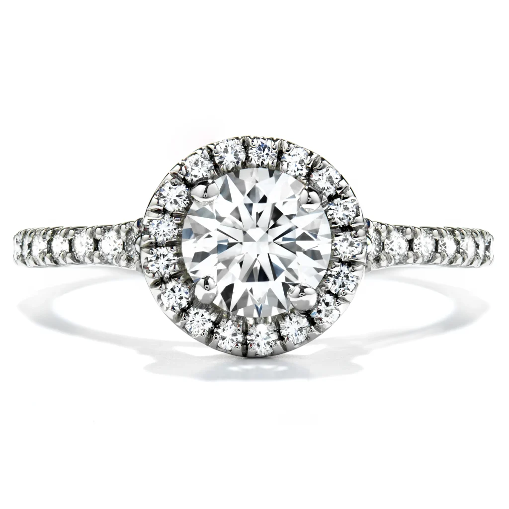 New Hearts On Fire diamond engagement ring with a diamond halo and diamonds in the band.