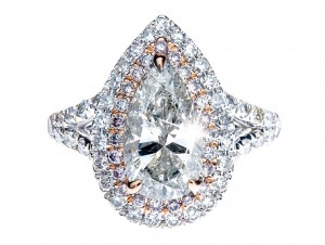 White gold and rose gold split shank diamond engagement ring with a double diamond halo and diamonds in the band.