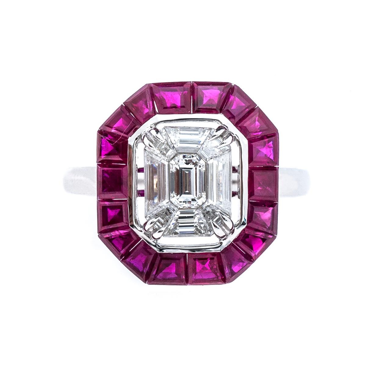 White gold ring centered with a diamond surrounded by a ruby halo.