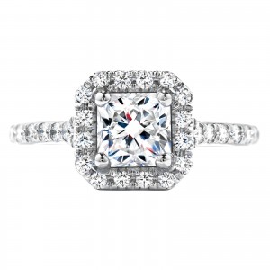 White gold diamond engagement ring surrounded by diamond halo and diamonds in the band.