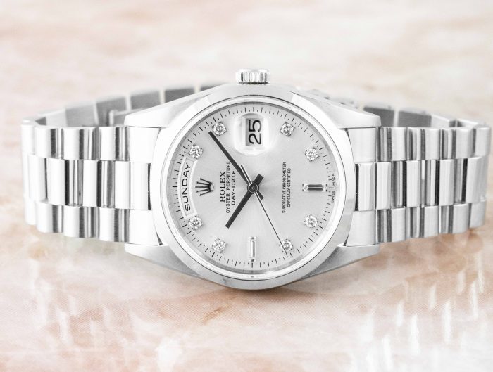 Pre-owned women's Rolex Day-Date in stainless steel with a white dial.