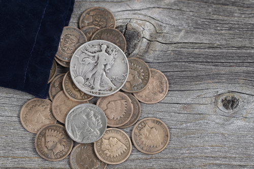 Pile of gold and silver coins.