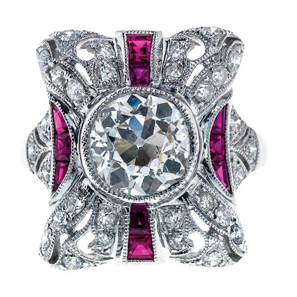 Antique white gold filigree statement ring set with diamonds and rubies.