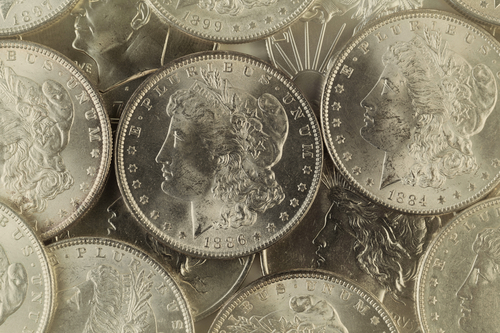 Pile of silver dollar coins.