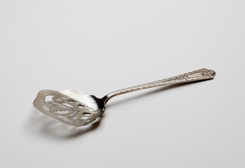 Antique silver serving spoon.