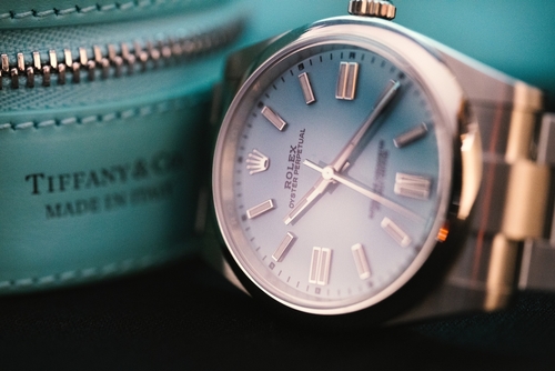 Tiffany & Co. Rolex in white gold next to Tiffany & Co. 1837 Blue jewelry case.