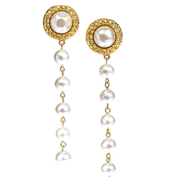 Vintage yellow gold Chanel station drop earrings set with white pearls.