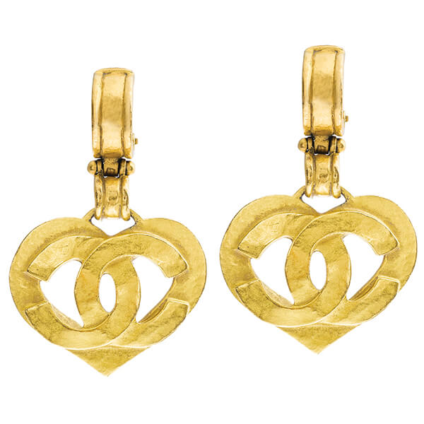 Vintage yellow gold Chanel heart-shaped logo dangle earrings.