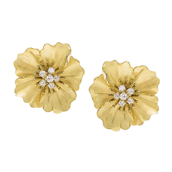 Yellow gold flower stud earrings with diamonds set in the center.