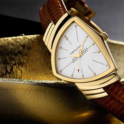 Pre-owned Hamilton Ventura in yellow gold with a white dial and brown leather strap.