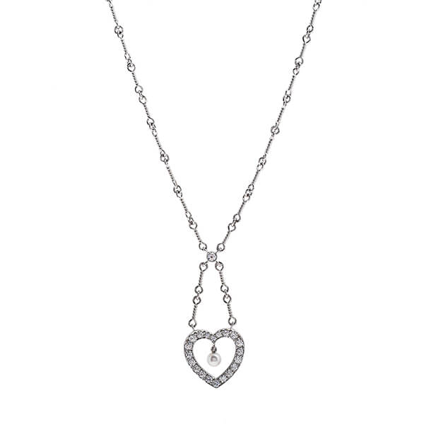 White gold open heart dangle necklace set with a white pearl and diamonds on a detailed
beaded chain.