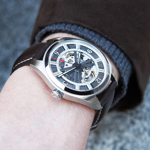 Pre-owned men’s Hamilton Open Heart Auto in stainless steel with an exhibition face and black leather strap.