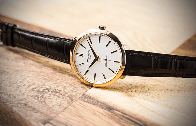 Pre-owned men’s Patek Philippe Calatrava in yellow gold with a black leather strap.