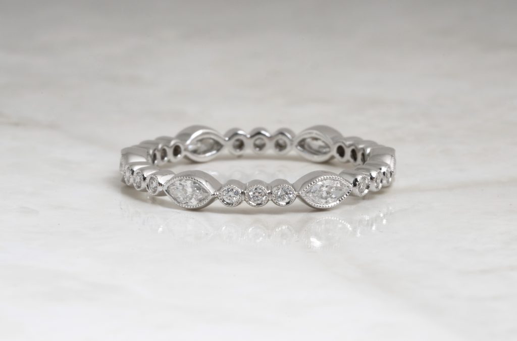 White gold twist wedding band set with diamonds.