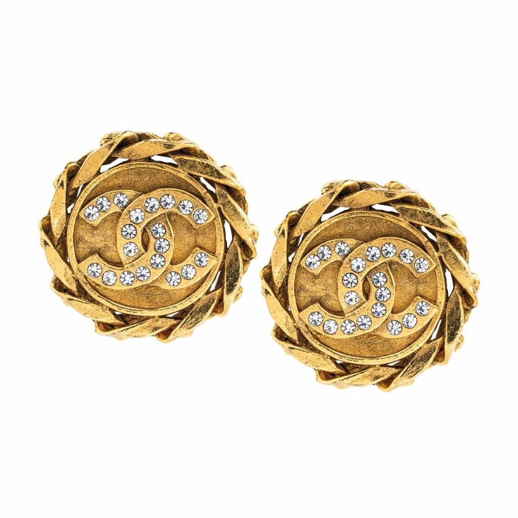 Vintage yellow gold Chanel logo stud earrings.
