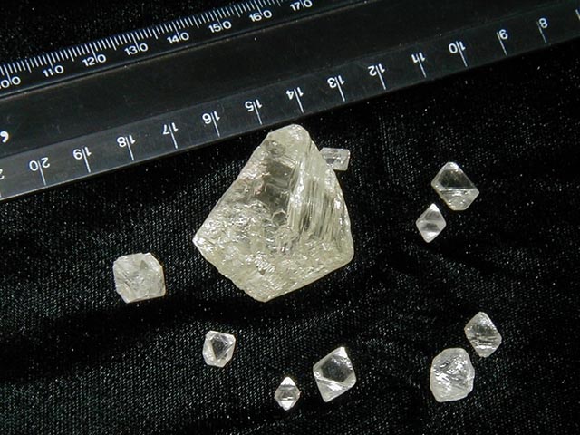 Loose uncut rough fancy light yellow diamonds.