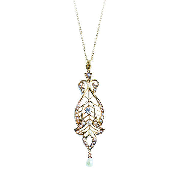 Antique yellow gold filigree drop pendant set with diamonds.