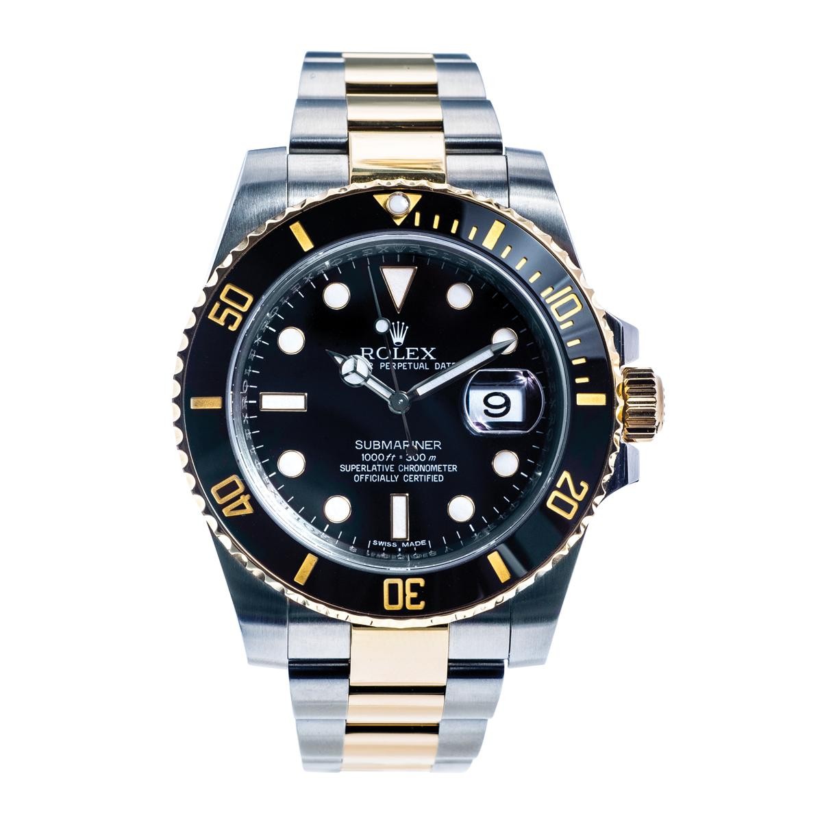 Pre-owned men’s Rolex Submariner in stainless steel and yellow gold with a black dial.