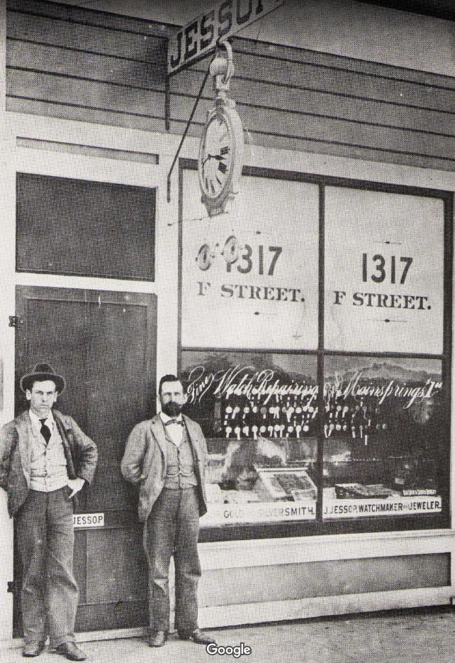 Historic black and white image of the Jessop’s brother standing outside their first
storefront in 1892.