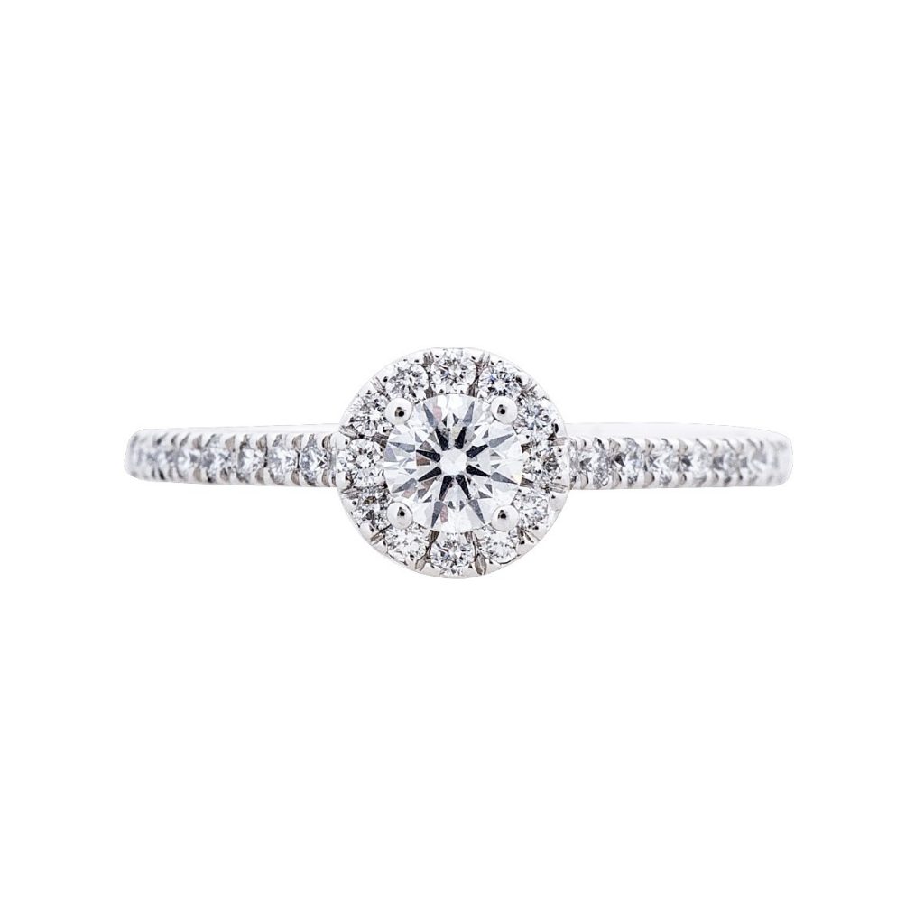 White gold diamond engagement ring with a diamond halo and diamonds in the band.