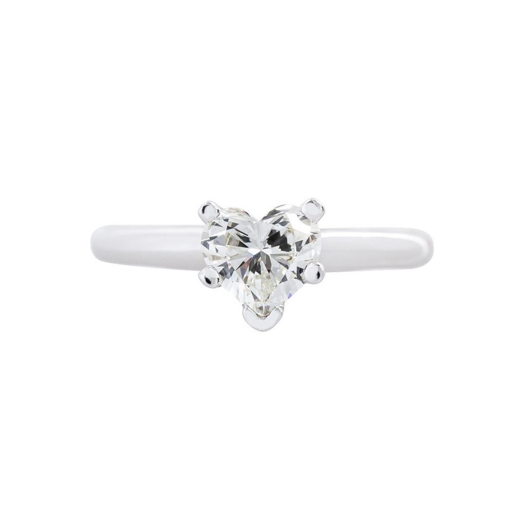 White gold solitaire heart-cut diamond engagement ring.