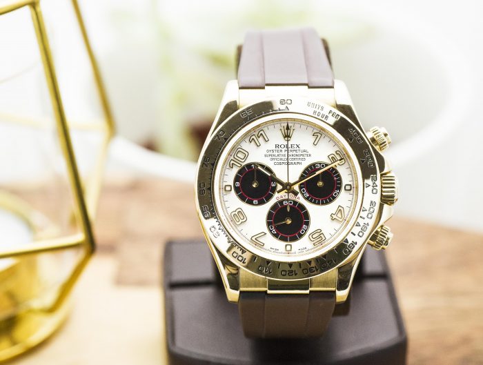 Pre-owned men’s Rolex Daytona in yellow gold with a brown leather strap.