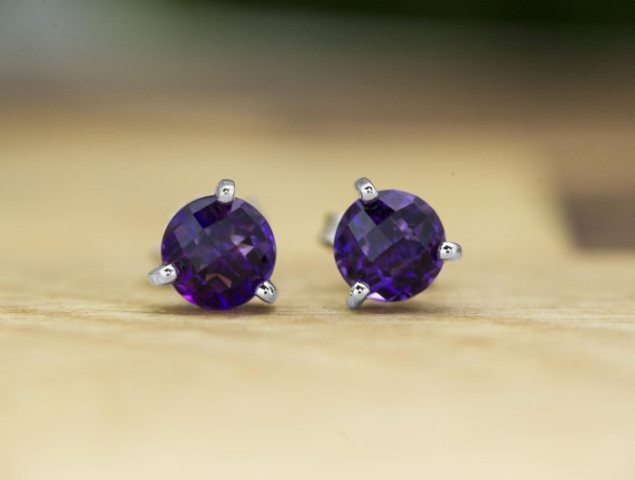 White gold stud earrings set with amethyst.