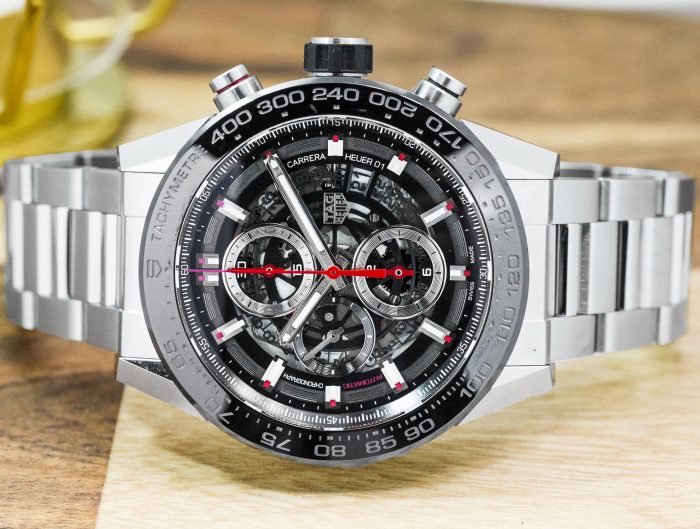 Pre-owned men’s TAG Heuer Carrera in stainless steel with a black dial.