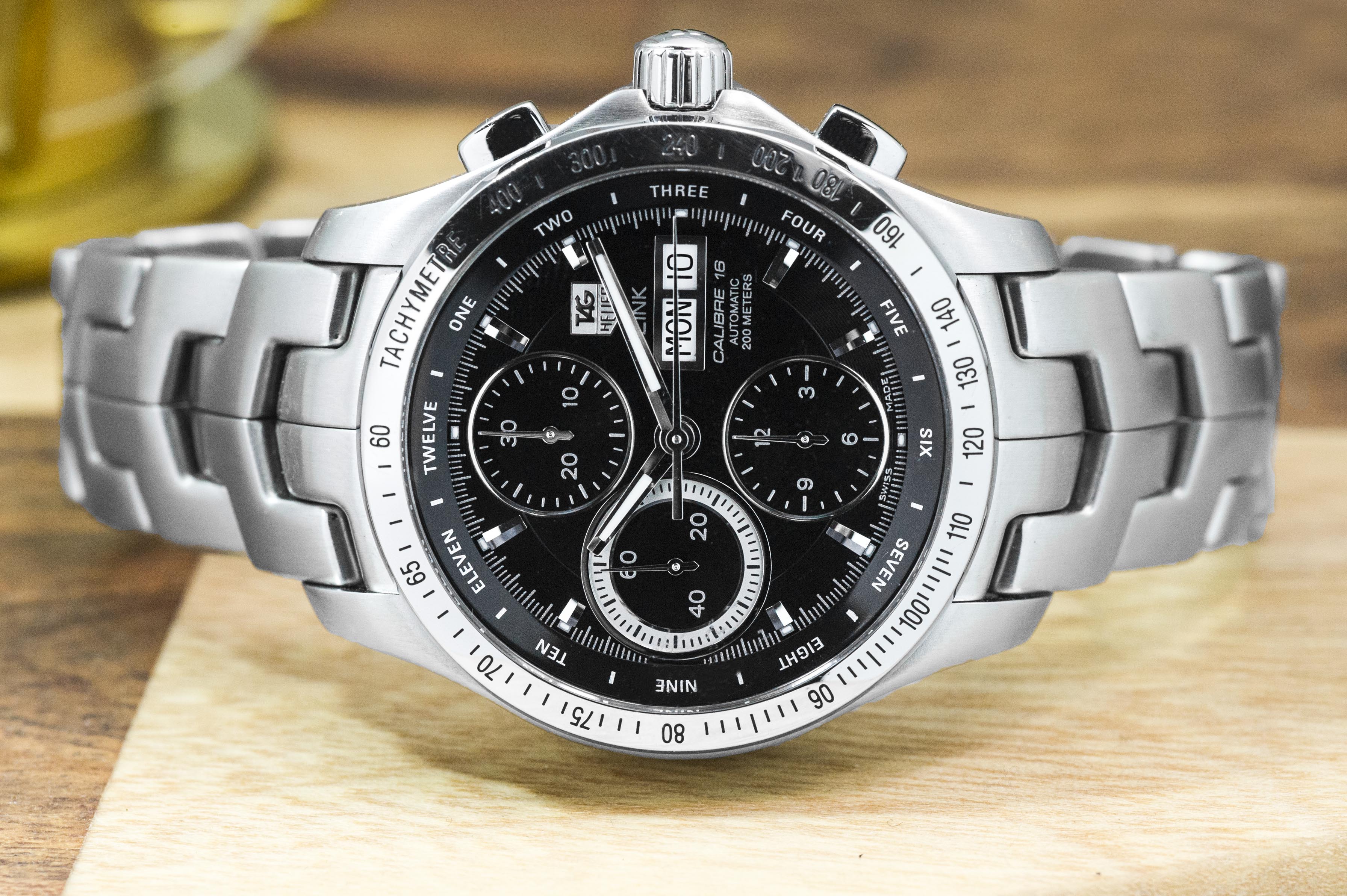 Pre-owned men's TAG Heuer Link in stainless steel with a black dial.