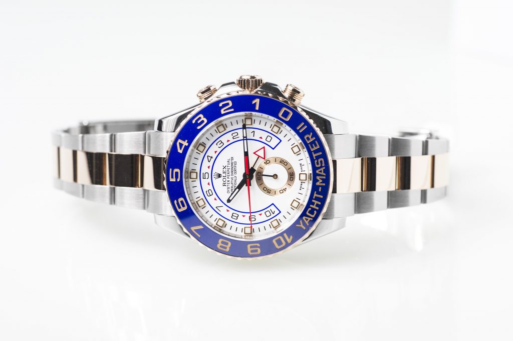 Pre-owned men’s Rolex Yacht-Master II in stainless steel and yellow gold with a blue ceramic bezel and white dial.