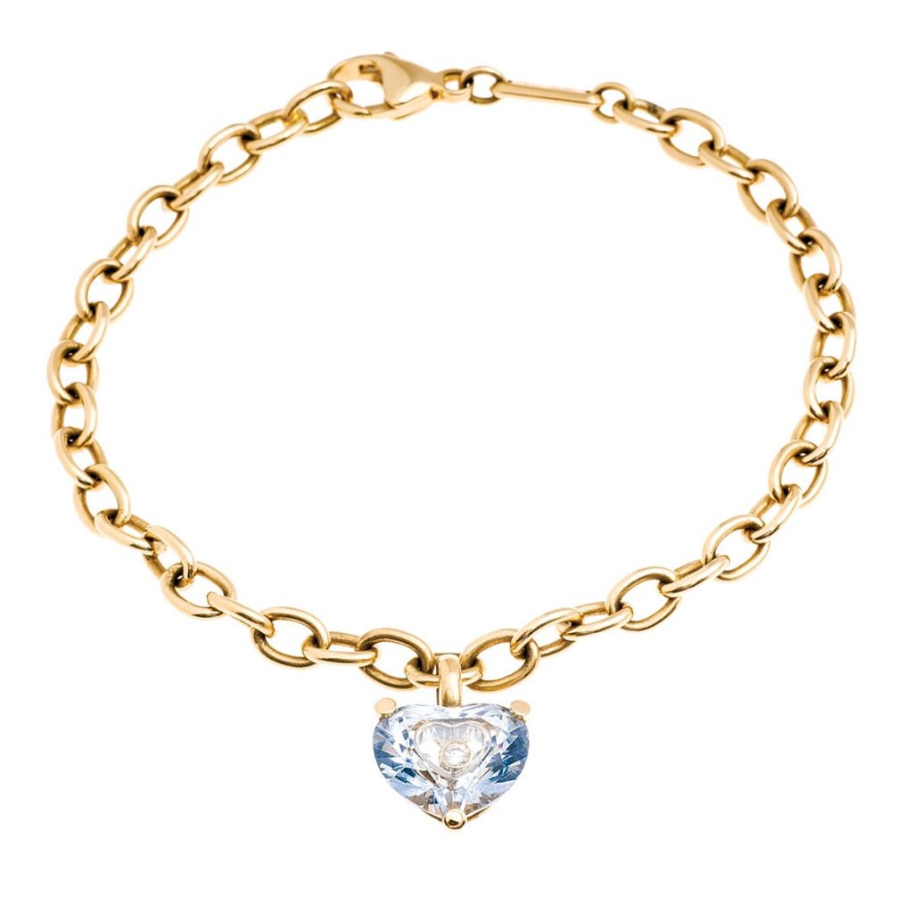 Vintage yellow gold Chopard bracelet set with a blue heart-shaped crystal and diamond.