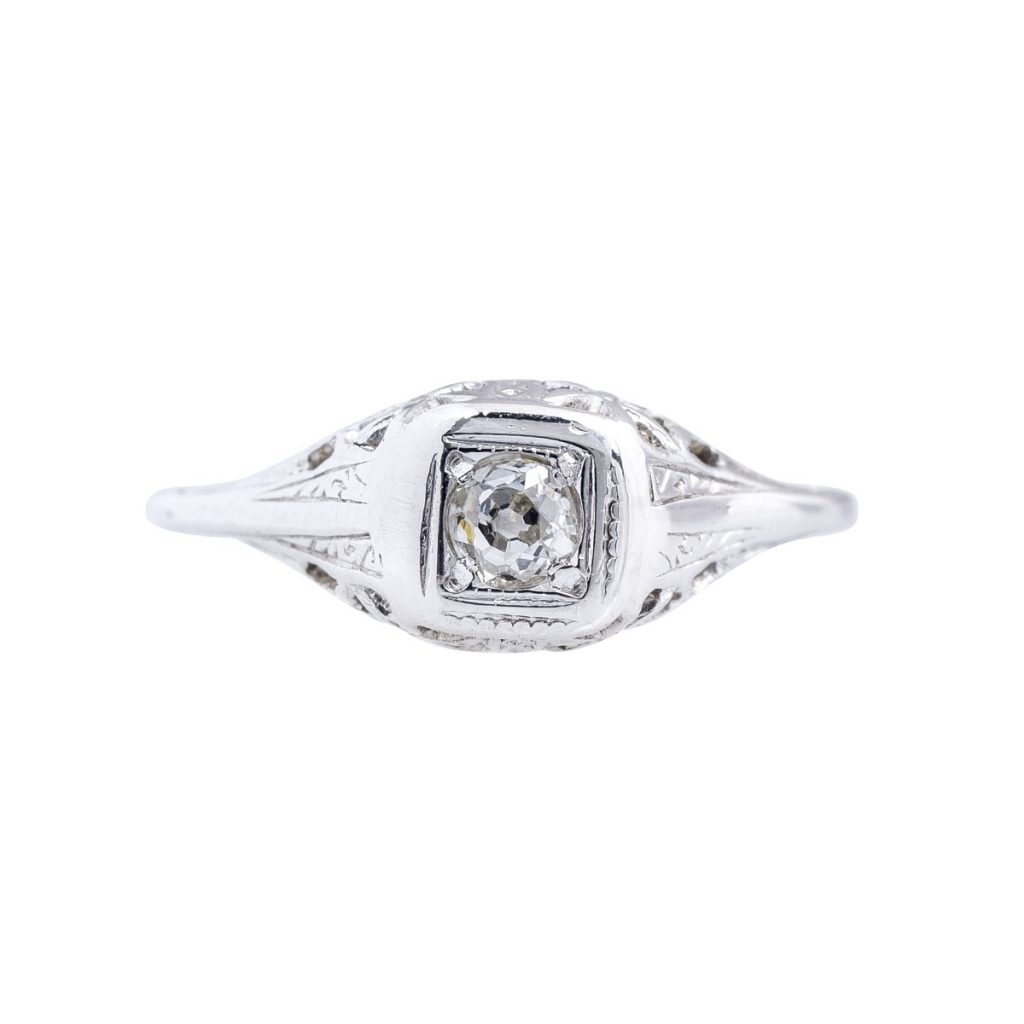 White gold engagement ring centered with a diamond.