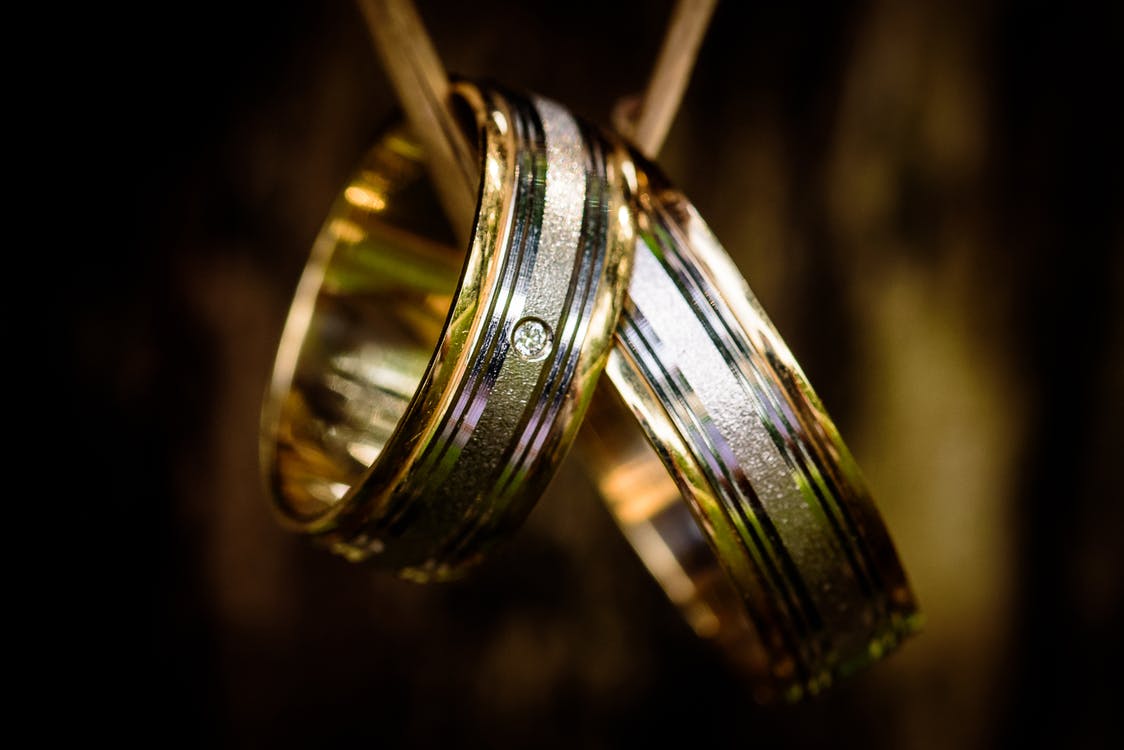 Two wedding bands made of mixed metals.