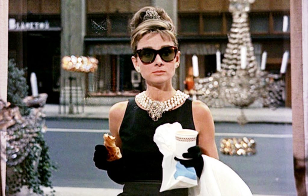 Still from Breakfast at Tiffany’s featuring Holly wearing vintage Tiffany & Co.
accessories.