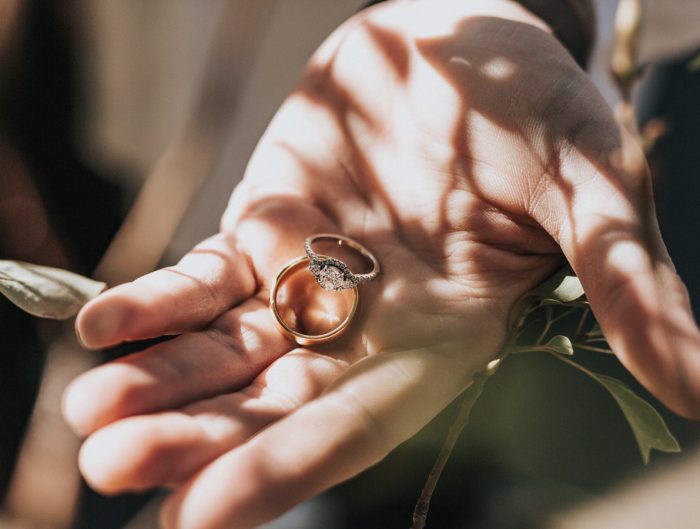 Yellow gold wedding ring and engagement ring set with lab-grown diamonds.