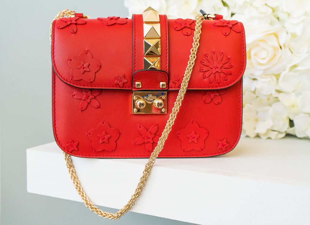 Vintage red leather Valentino shoulder bag with gold hardware.