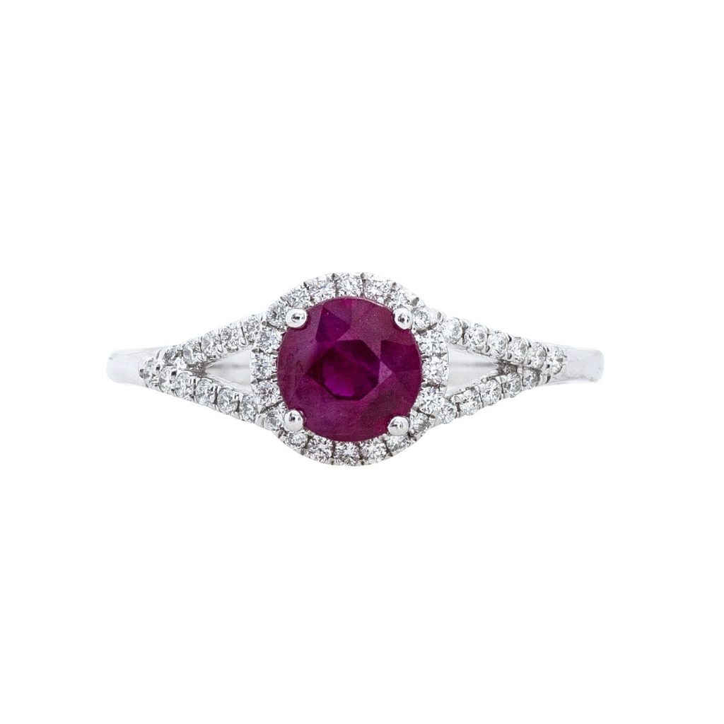 White gold split shank ruby ring with diamonds in the bands.