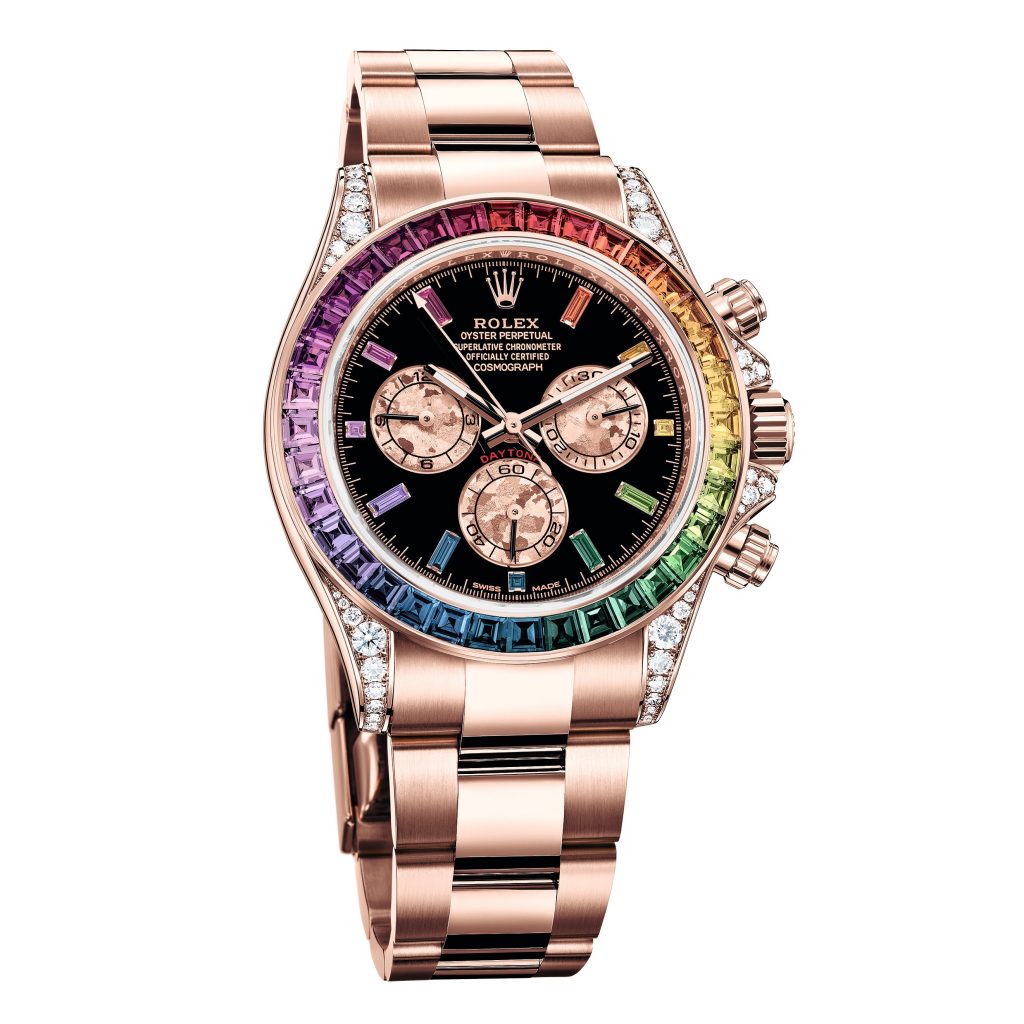 Pre-owned women’s Rolex Daytona in rose gold with a black dial and rainbow diamonds
bezel.