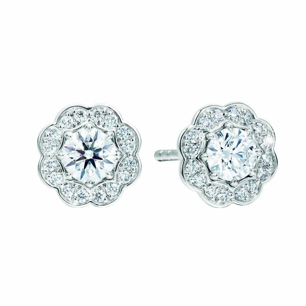 White gold diamond stud earrings with diamond haloes.