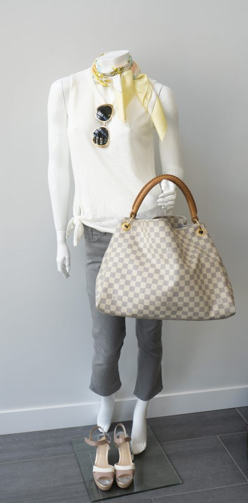 Mannequin with white blouse, grey slacks, strappy heels, vintage sunglasses, vintage
scarf, and vintage handbag.