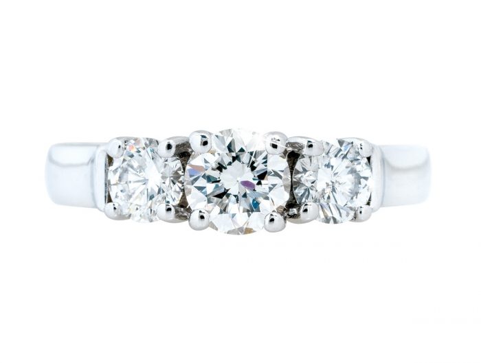 White gold three-stone diamond engagement ring.