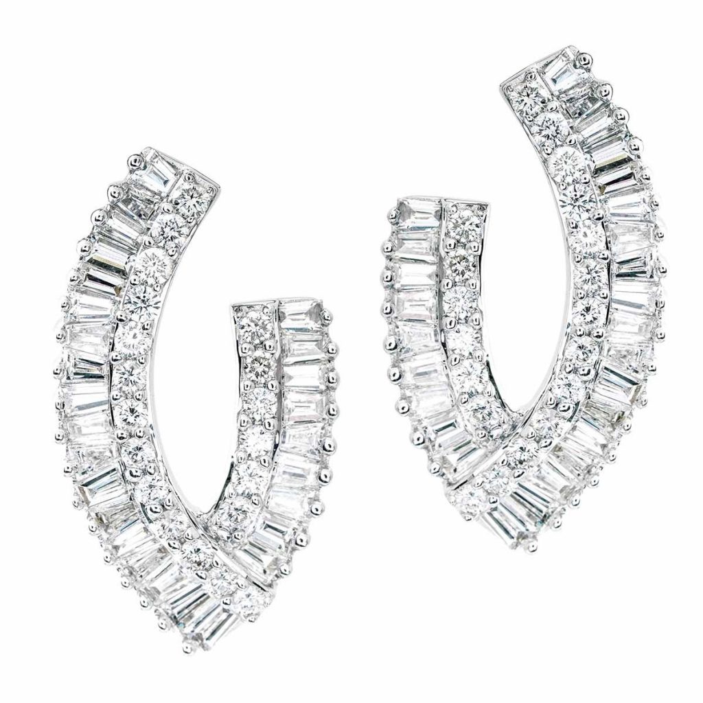 White gold “V” hoop earrings set with diamonds.