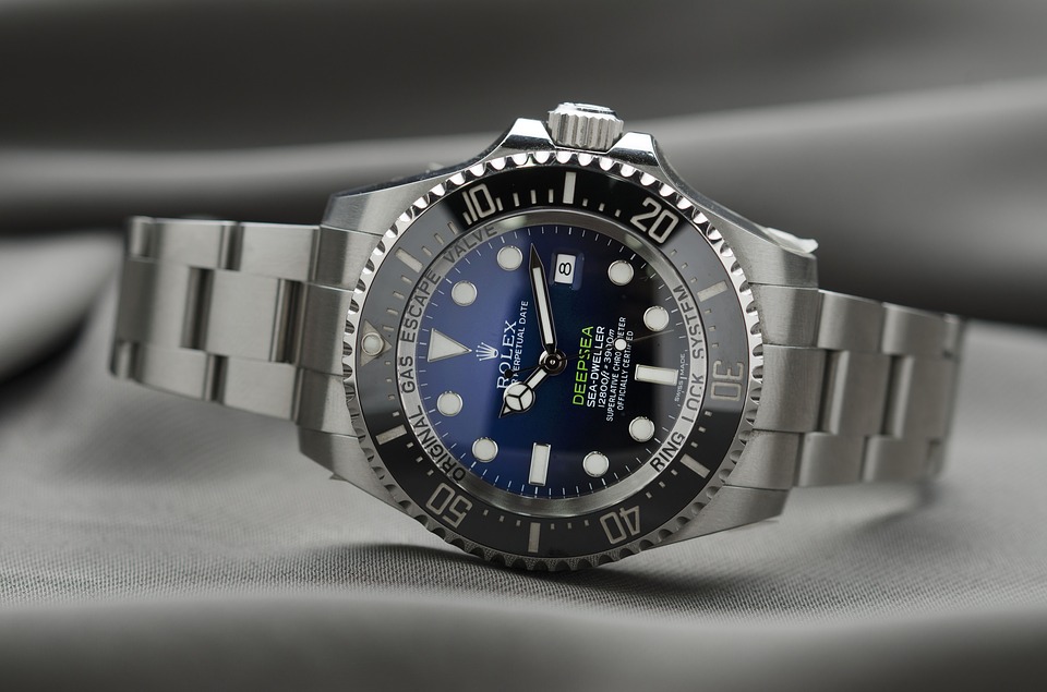 Rolex in stainless steel with a blue dial.